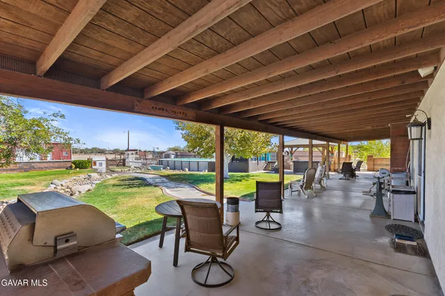 a view of a swimming pool and outdoor seating
