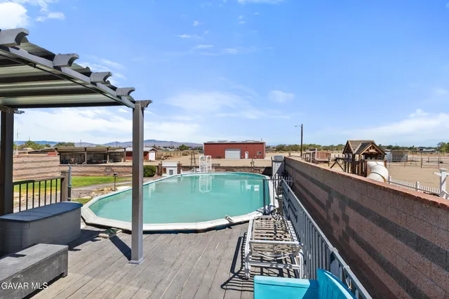 a view of swimming pool from a balcony