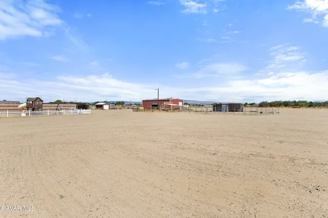 a view of a lake with houses in the back