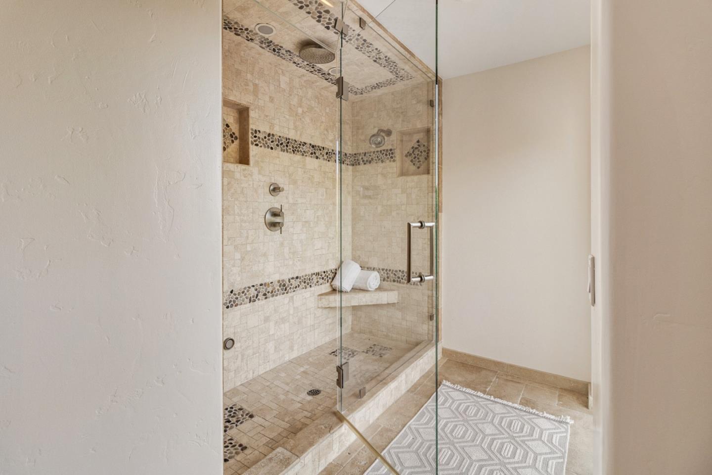 320 El Caminito Road Carmel Valley, CA 93924 - Photo 39 of 62 a bathroom with a glass shower door