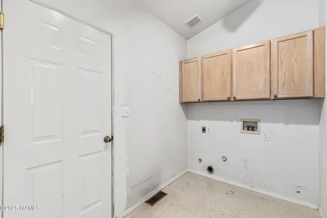 a view of cabinets and window