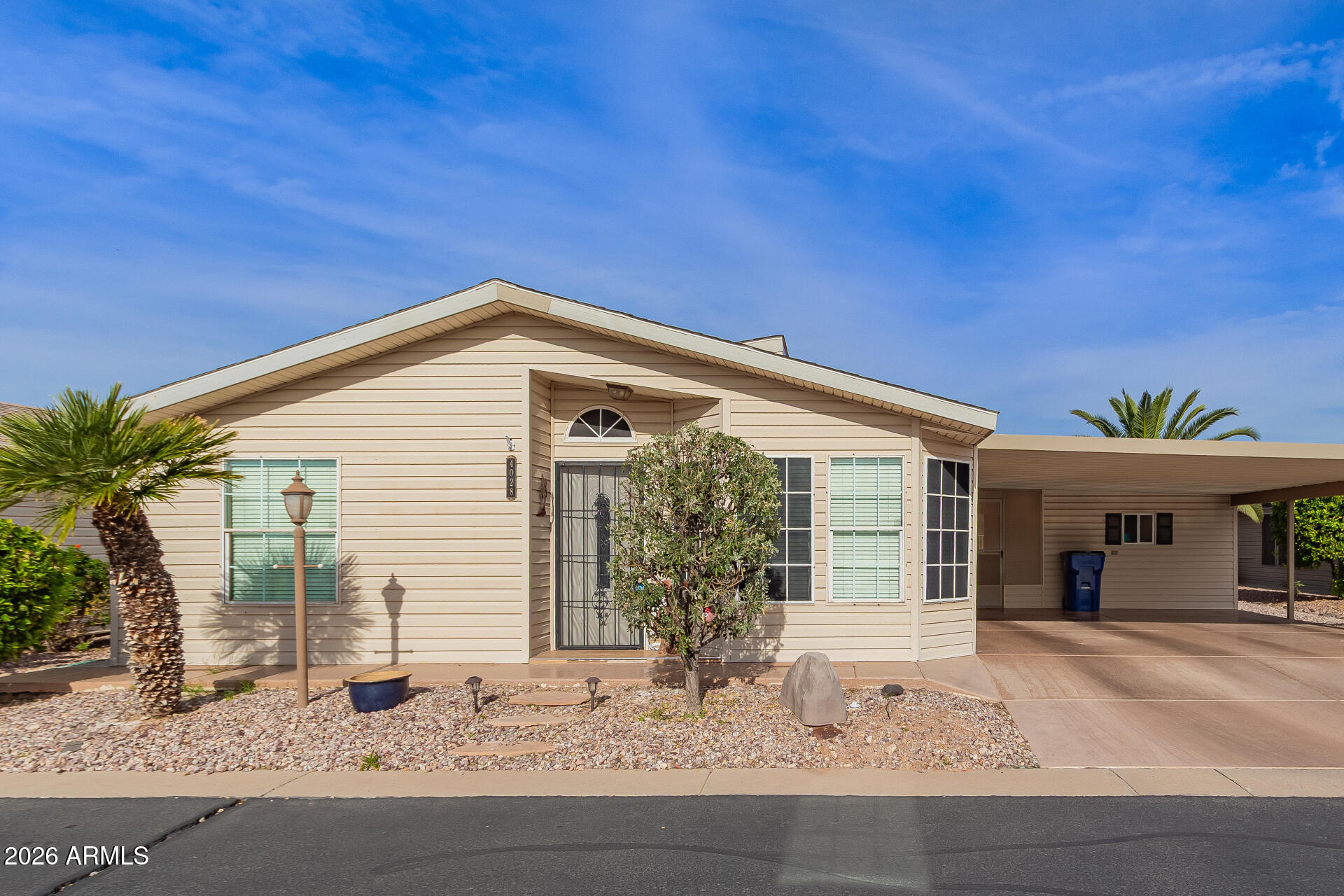 3301 South Goldfield Road, Unit 4028 Apache Junction, AZ 85119 - Photo 13 of 40 a front view of a house with porch