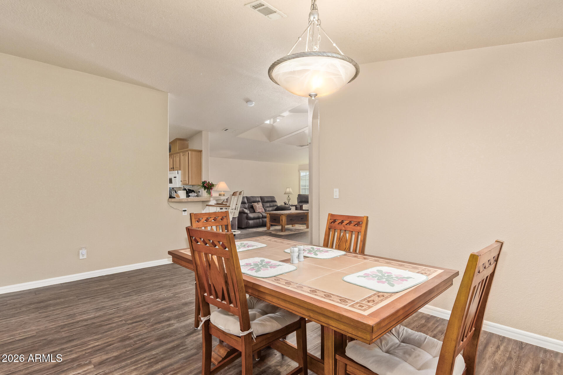 3301 South Goldfield Road, Unit 4028 Apache Junction, AZ 85119 - Photo 19 of 40 a view of a dining room with furniture and wooden floor