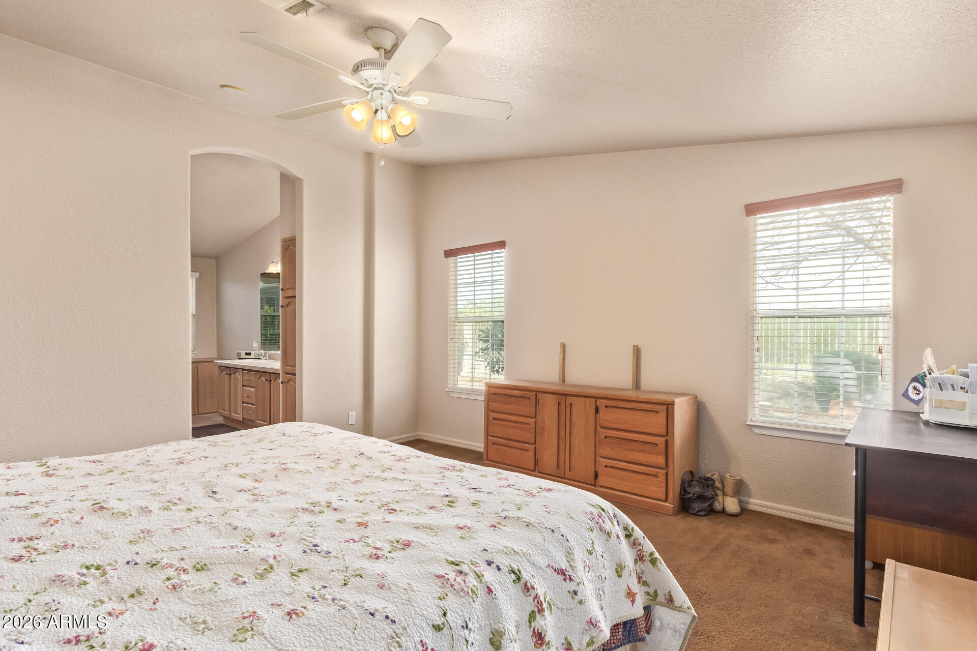 3301 South Goldfield Road, Unit 4028 Apache Junction, AZ 85119 - Photo 23 of 40 a bedroom with a bed dresser and a window
