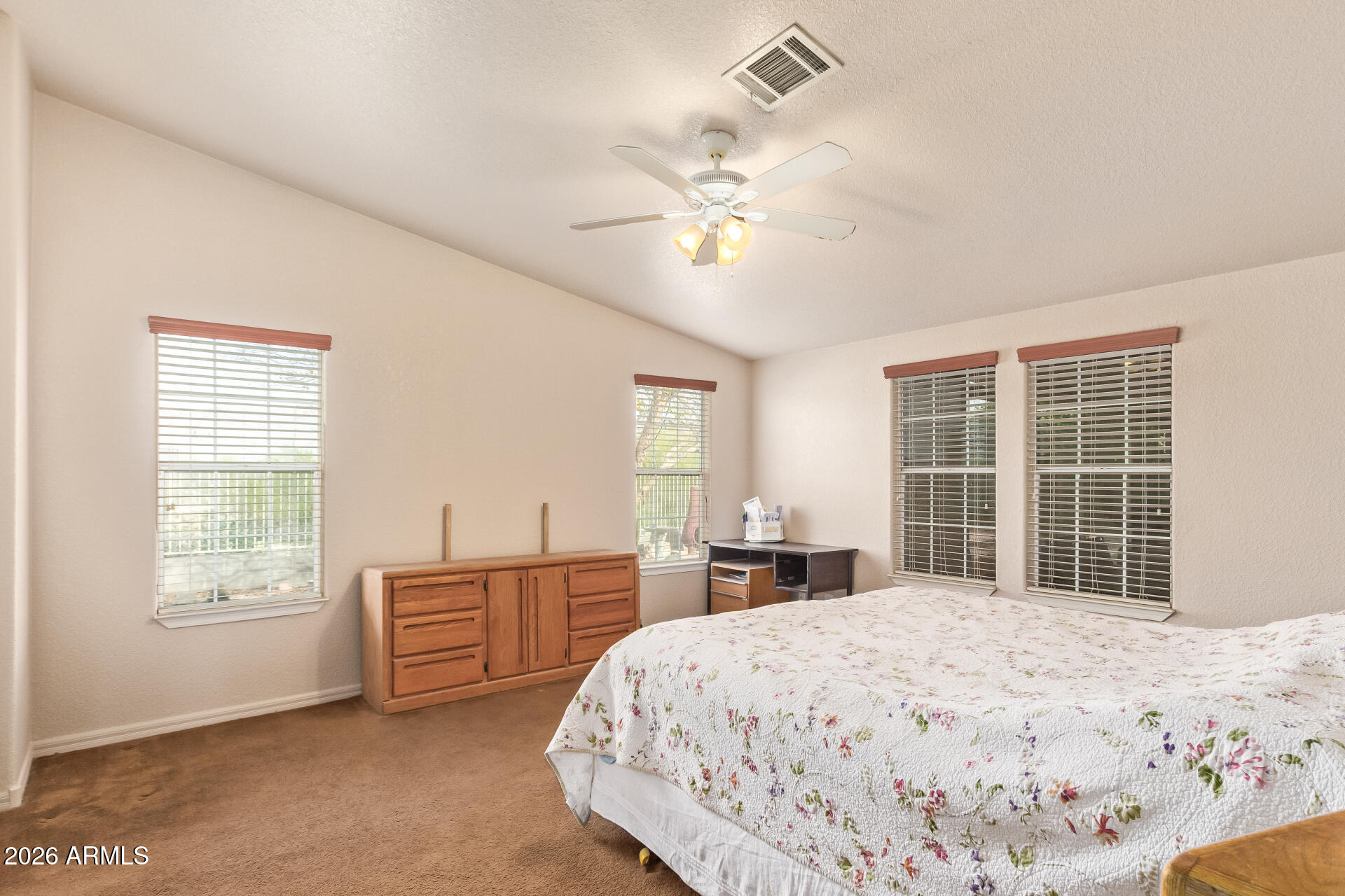 3301 South Goldfield Road, Unit 4028 Apache Junction, AZ 85119 - Photo 8 of 40 a bedroom with a large bed and a window