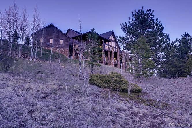 2 Dill Pickle Place Black Hawk, CO 80422 - Photo 3 of 39 a view of a big yard with plants and large trees