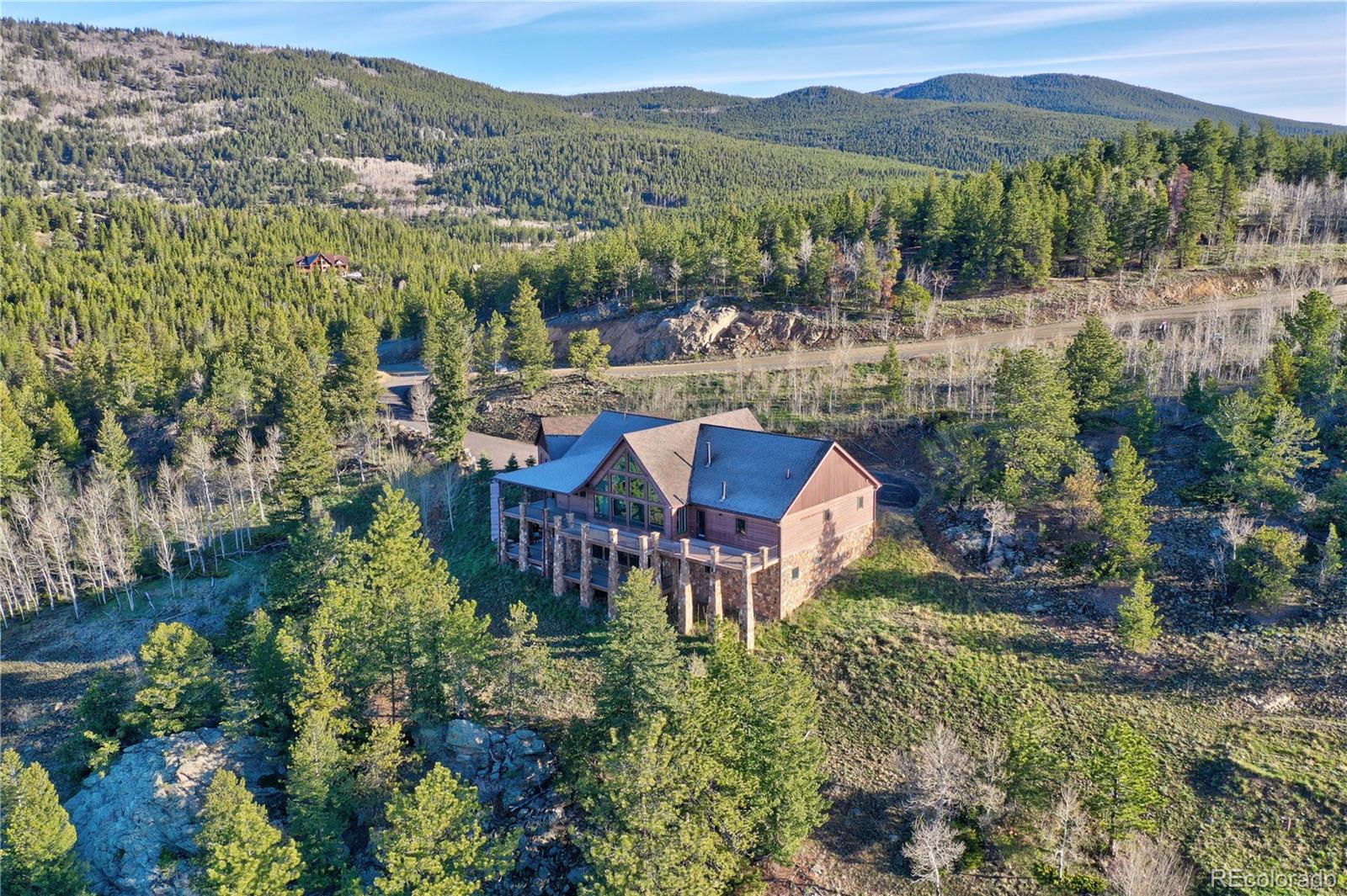 2 Dill Pickle Place Black Hawk, CO 80422 - Photo 4 of 39 an aerial view of a house with a garden and lake view