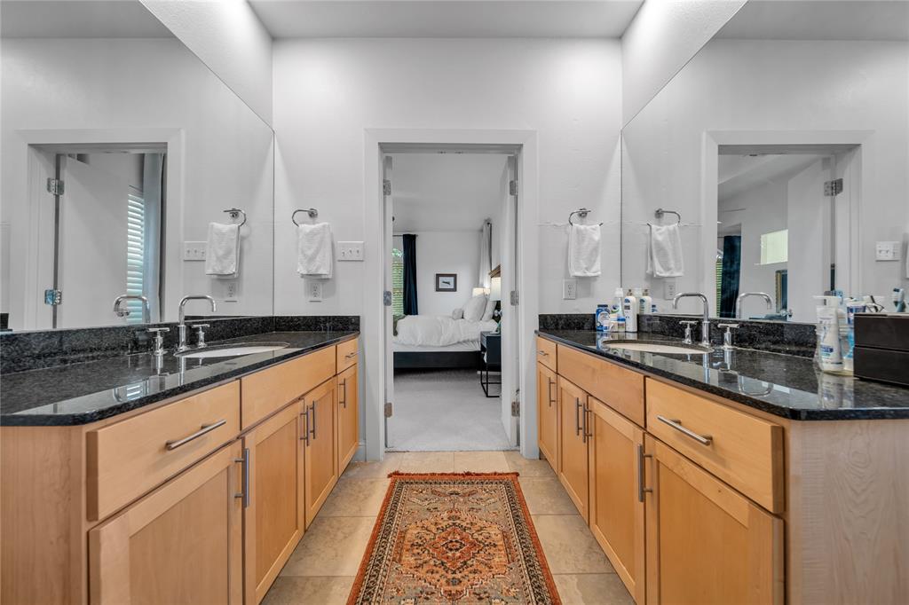 4317 Cedar Springs Road, Unit A Dallas, TX 75219 - Photo 14 of 27 a large bathroom with double vanity sinks and a bathtub