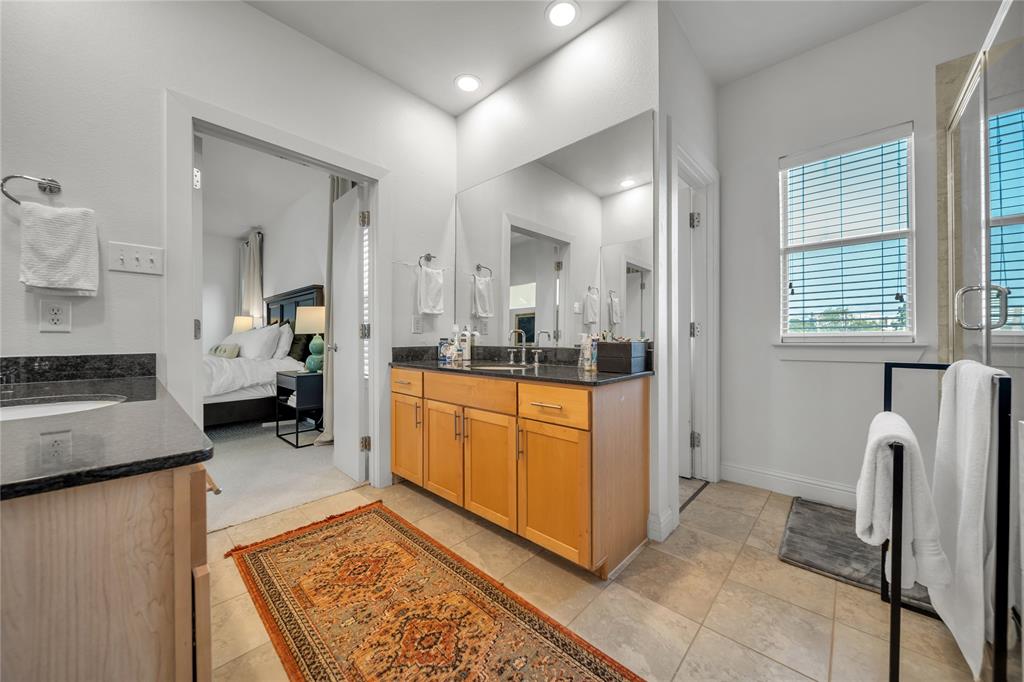 4317 Cedar Springs Road, Unit A Dallas, TX 75219 - Photo 15 of 27 a kitchen with stainless steel appliances granite countertop a refrigerator and a stove top oven