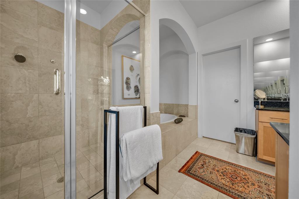 4317 Cedar Springs Road, Unit A Dallas, TX 75219 - Photo 16 of 27 a living room with furniture a rug and a shower