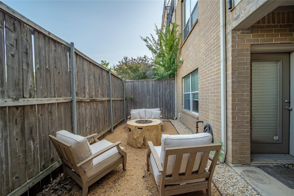 4317 Cedar Springs Road, Unit A Dallas, TX 75219 - Photo 22 of 27 a view of a patio with a table and chairs