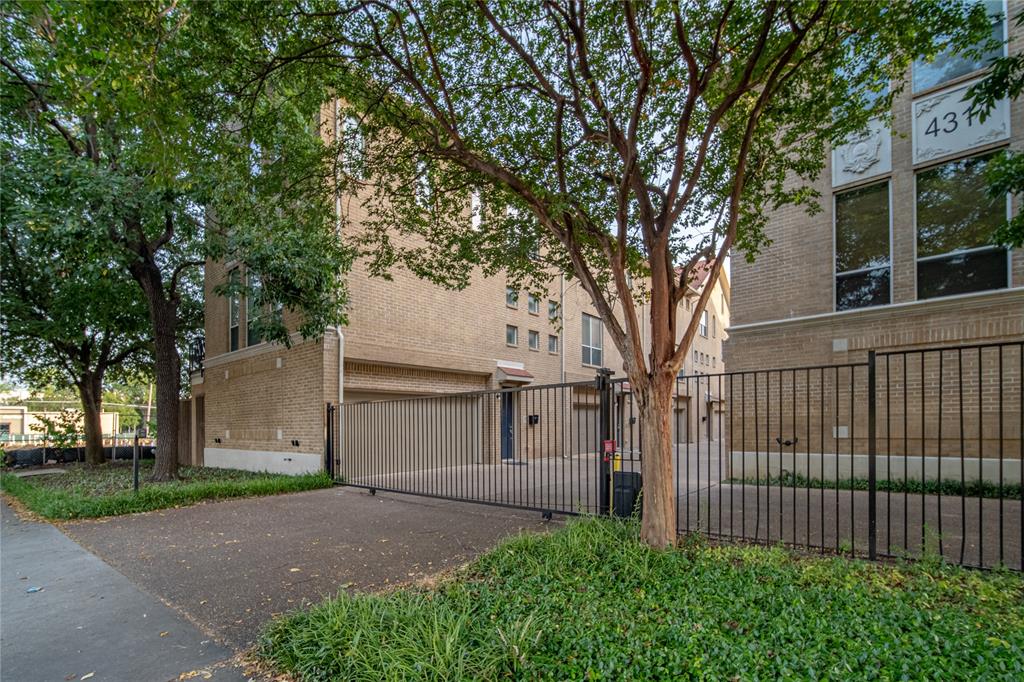 4317 Cedar Springs Road, Unit A Dallas, TX 75219 - Photo 25 of 27 a white house that has tree in front of it