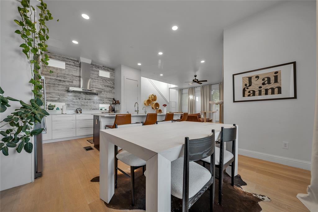 4317 Cedar Springs Road, Unit A Dallas, TX 75219 - Photo 7 of 27 a kitchen with a table and chairs in it