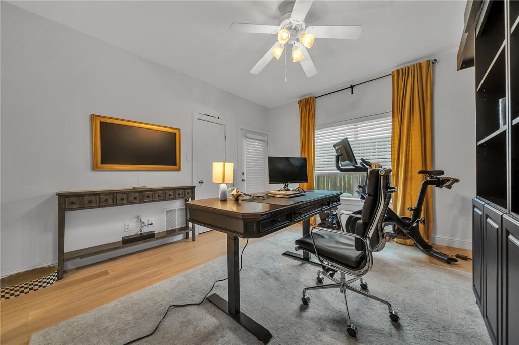 4317 Cedar Springs Road, Unit A Dallas, TX 75219 - Photo 9 of 27 a view of a workspace with furniture and a window