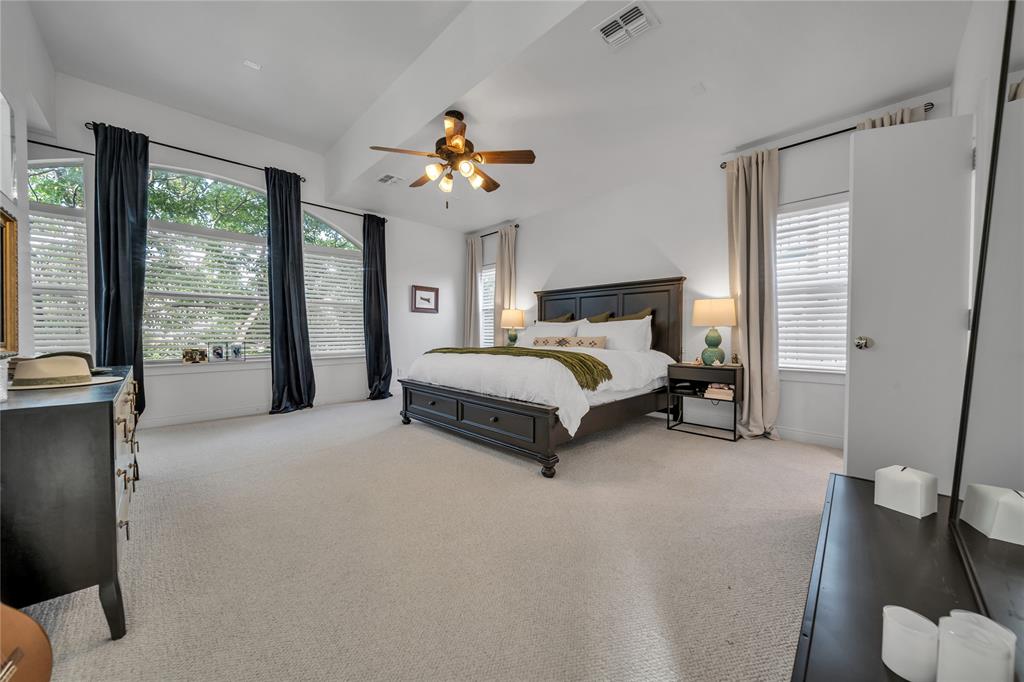 4317 Cedar Springs Road, Unit A Dallas, TX 75219 - Photo 10 of 27 a spacious bedroom with a bed and a large window
