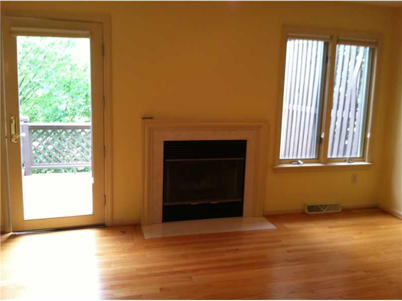 148 Shadow Ridge Drive, Unit 148 Pittsburgh, PA 15238 - Photo 17 of 25 Den/Family/Great Room. Den is light and bright. This door open out onto deck and lovely trees and view...Plenty of room for a grill and outdoor seating...