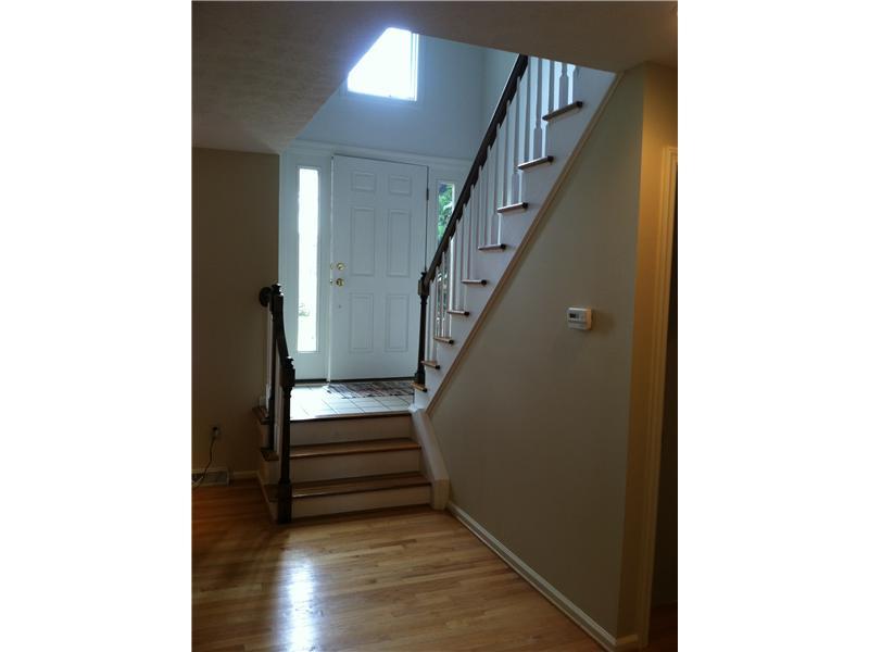 148 Shadow Ridge Drive, Unit 148 Pittsburgh, PA 15238 - Photo 5 of 25 Entry/Foyer. Looking at front door from living room. Great neutral wall color, freshly painted living room.