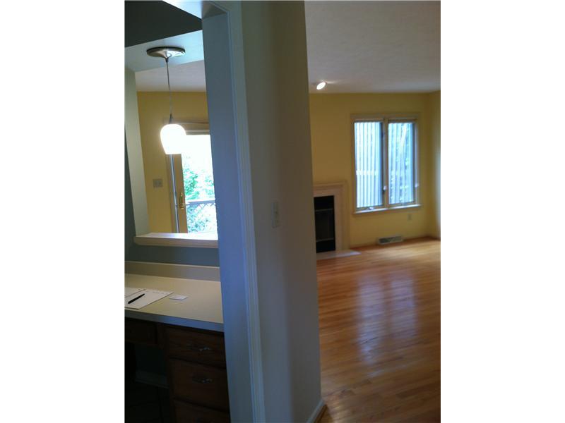 148 Shadow Ridge Drive, Unit 148 Pittsburgh, PA 15238 - Photo 9 of 25 Den/Family/Great Room. This is the view from kitchen pantry wall into den.