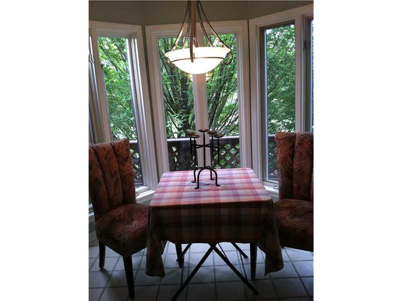 148 Shadow Ridge Drive, Unit 148 Pittsburgh, PA 15238 - Photo 10 of 25 Kitchen. Great eat-in kitchen with lovely view into the green space behind Forest Highlands...Note the new light fixture. Great with the wall color in kitchen.
