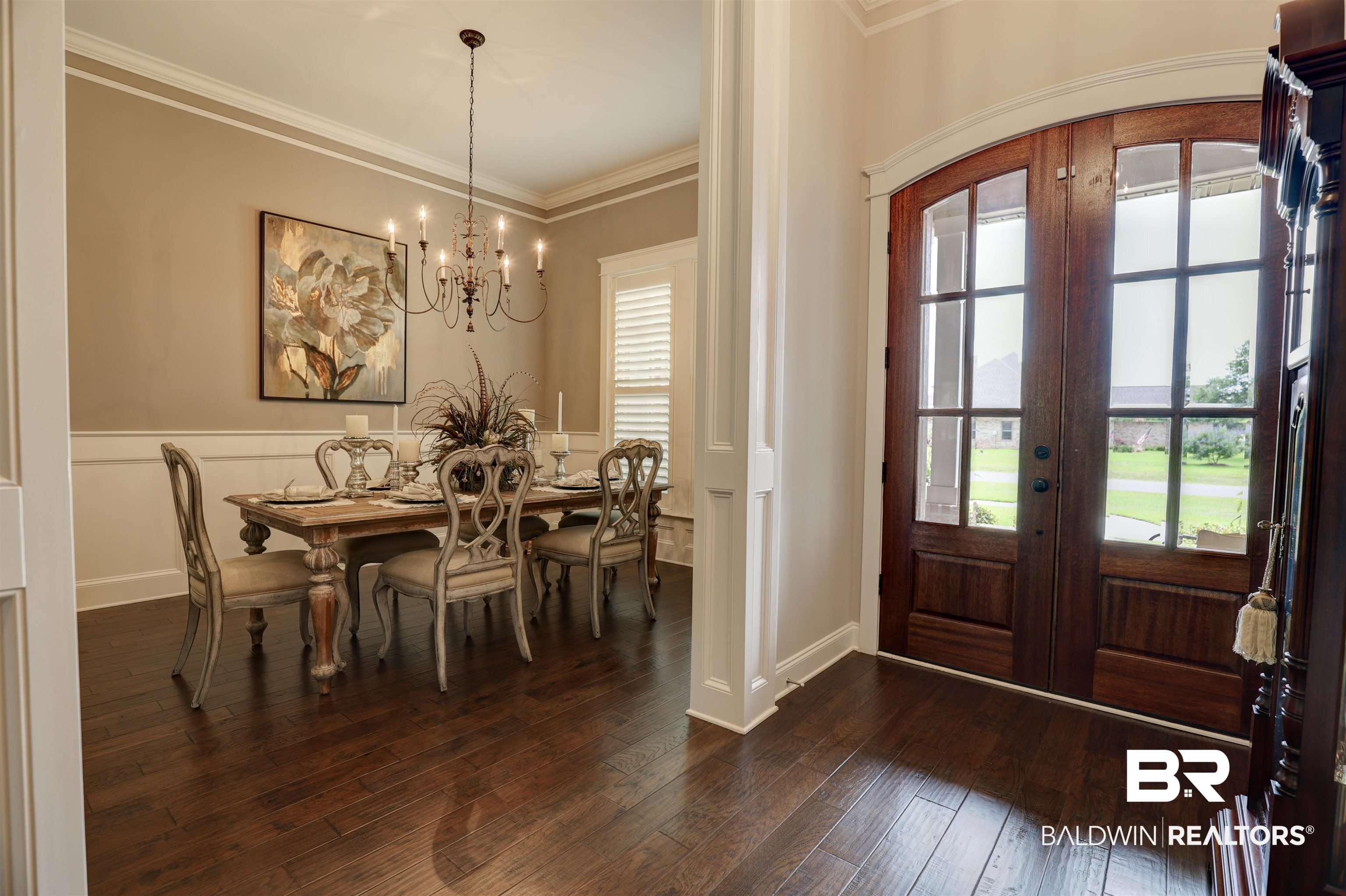 10588 Leesburg Pike Daphne, AL 36526 - Photo 5 of 29 Entryway with a notable chandelier, dark hardwood / wood-style flooring, ornamental molding, and french doors