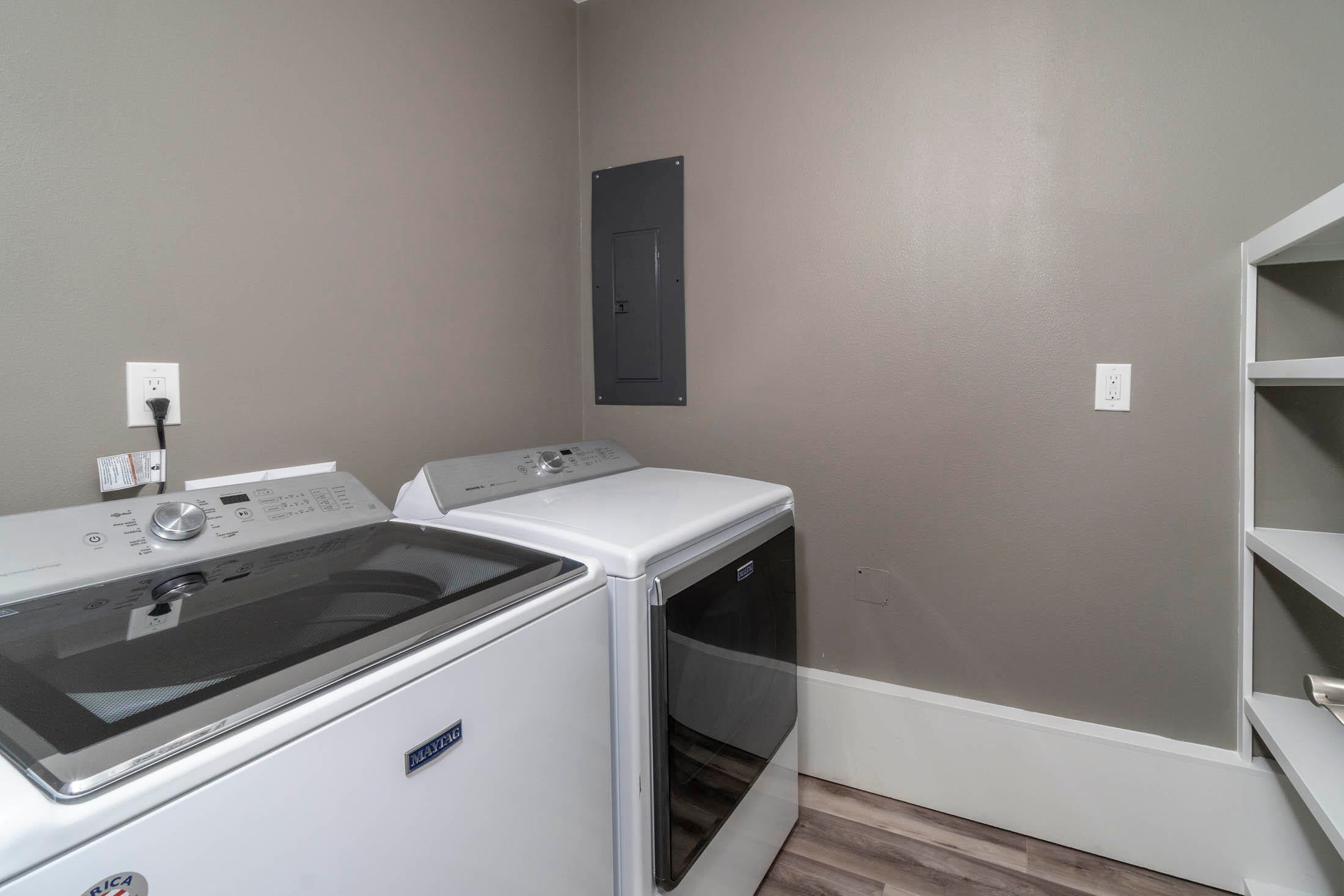 64486 McGrath Road Bend, OR 97701 - Photo 26 of 38 Large laundry room with Maytag extra large capacity washer and dryer and built in shelving