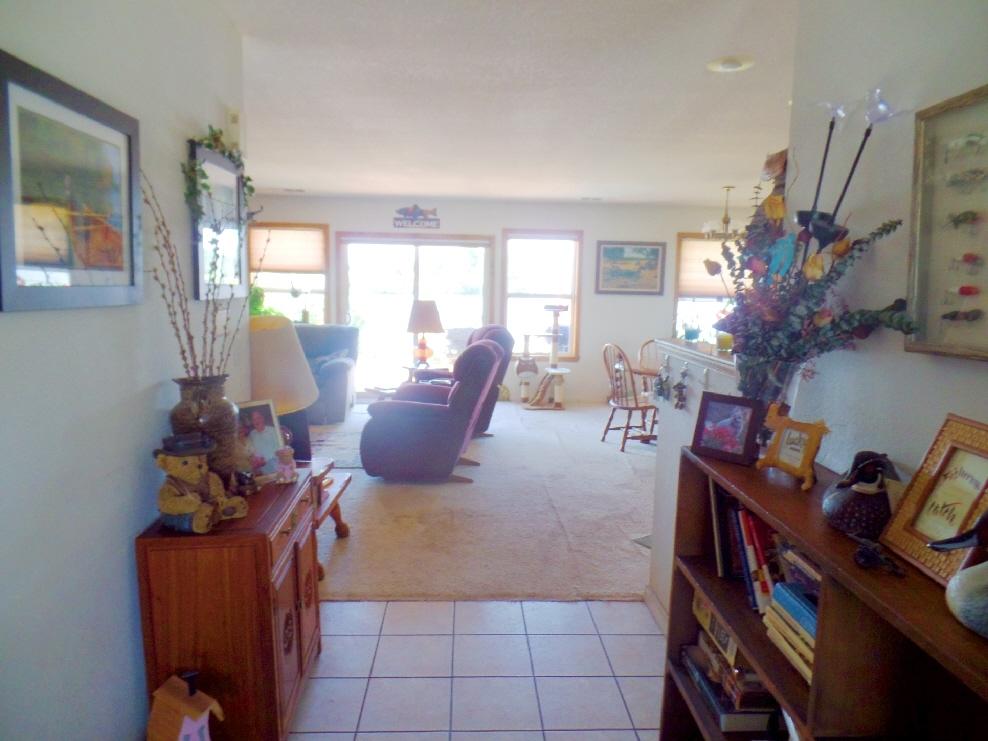 41888 Creighton Road Fall River Mills, CA 96028 - Photo 11 of 31 a living room with furniture and a flat screen tv