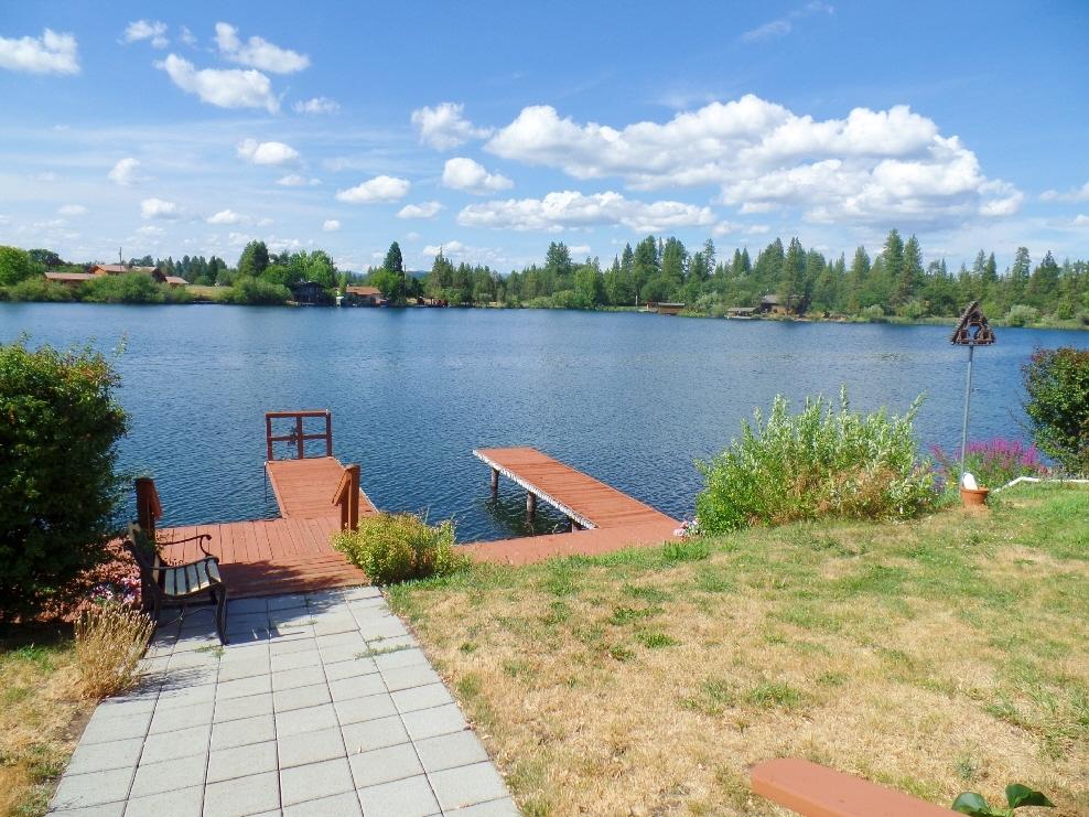 41888 Creighton Road Fall River Mills, CA 96028 - Photo 6 of 31 a view of a lake with houses in the back