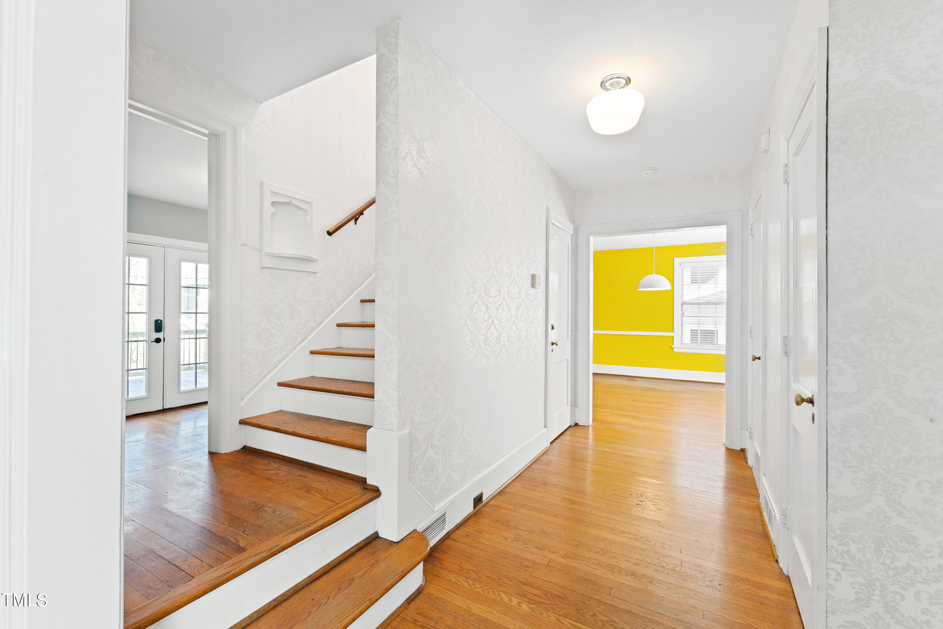 305 Hillcrest Road Raleigh, NC 27605 - Photo 5 of 45 a view of an room with wooden floor and a swimming pool