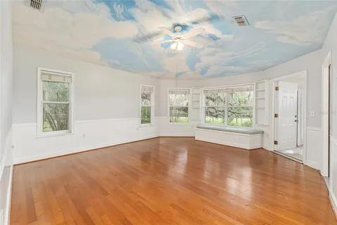 a white toilet sitting next to a shower curtain