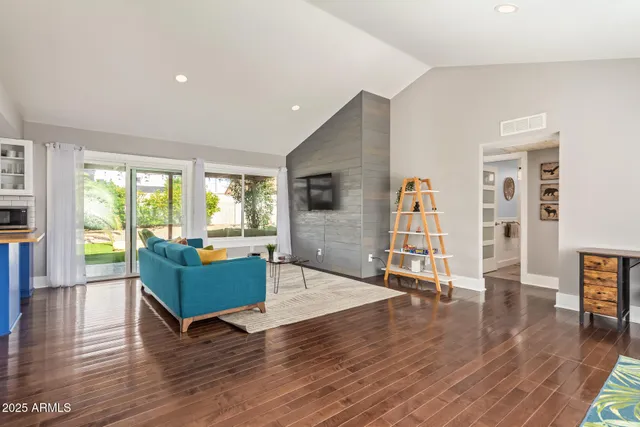 a living room with furniture and a large window