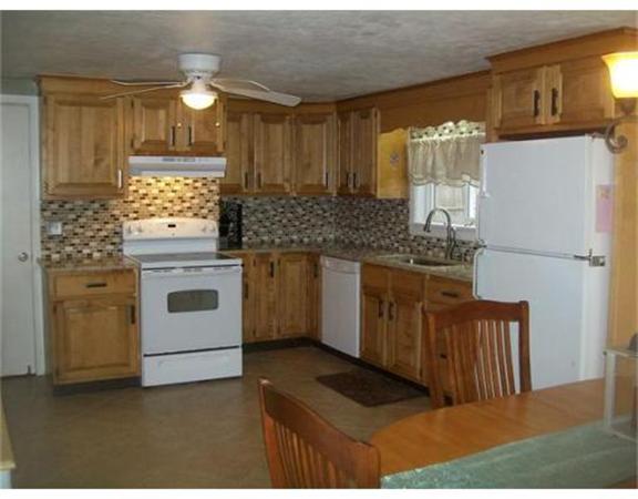 5 Fair Oak Road Springfield, MA 01128 - Photo 3 of 15 a kitchen with stainless steel appliances granite countertop a stove a refrigerator and a cabinets