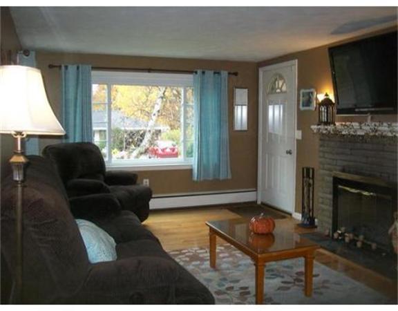 5 Fair Oak Road Springfield, MA 01128 - Photo 7 of 15 a living room with furniture a flat screen tv and a fireplace