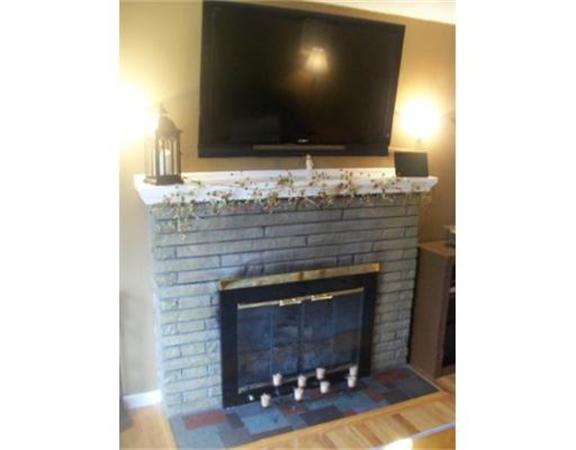 5 Fair Oak Road Springfield, MA 01128 - Photo 8 of 15 a living room with fireplace and a fireplace