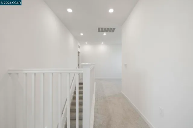 a view of hallway with stairs