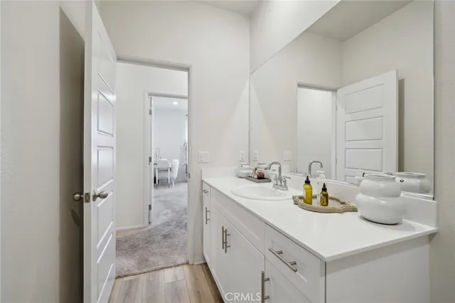 a bathroom with a sink double vanity and mirror