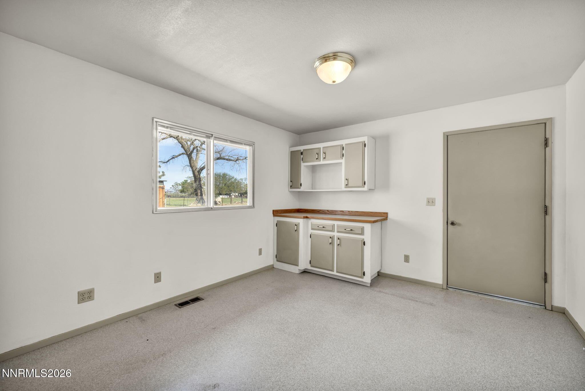 5250 Stillwater Road Fallon, NV 89406 - Photo 17 of 53 a view of a kitchen with wooden floor and window