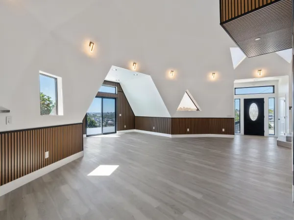 a kitchen with stainless steel appliances a stove a microwave and a white cabinets