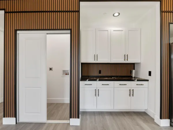 a view of a kitchen with a sink and a window