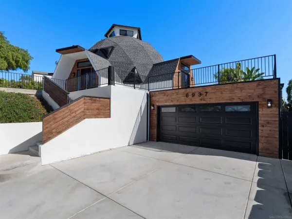 a front view of a house with a garage
