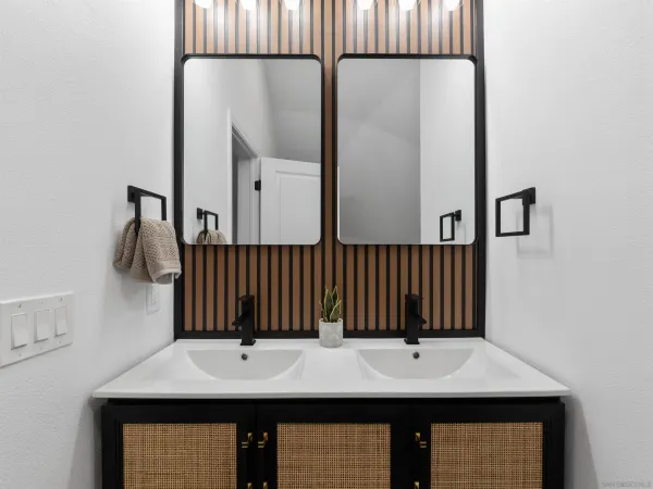 a bathroom with a toilet and a mirror