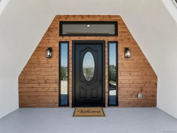 a view of a wooden door with a window