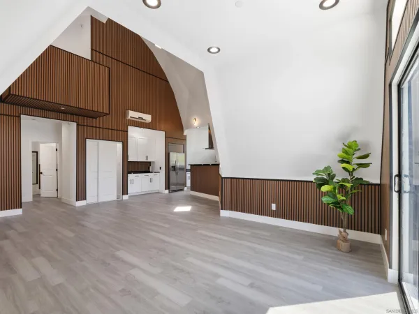 a kitchen with granite countertop a sink stainless steel appliances and cabinets