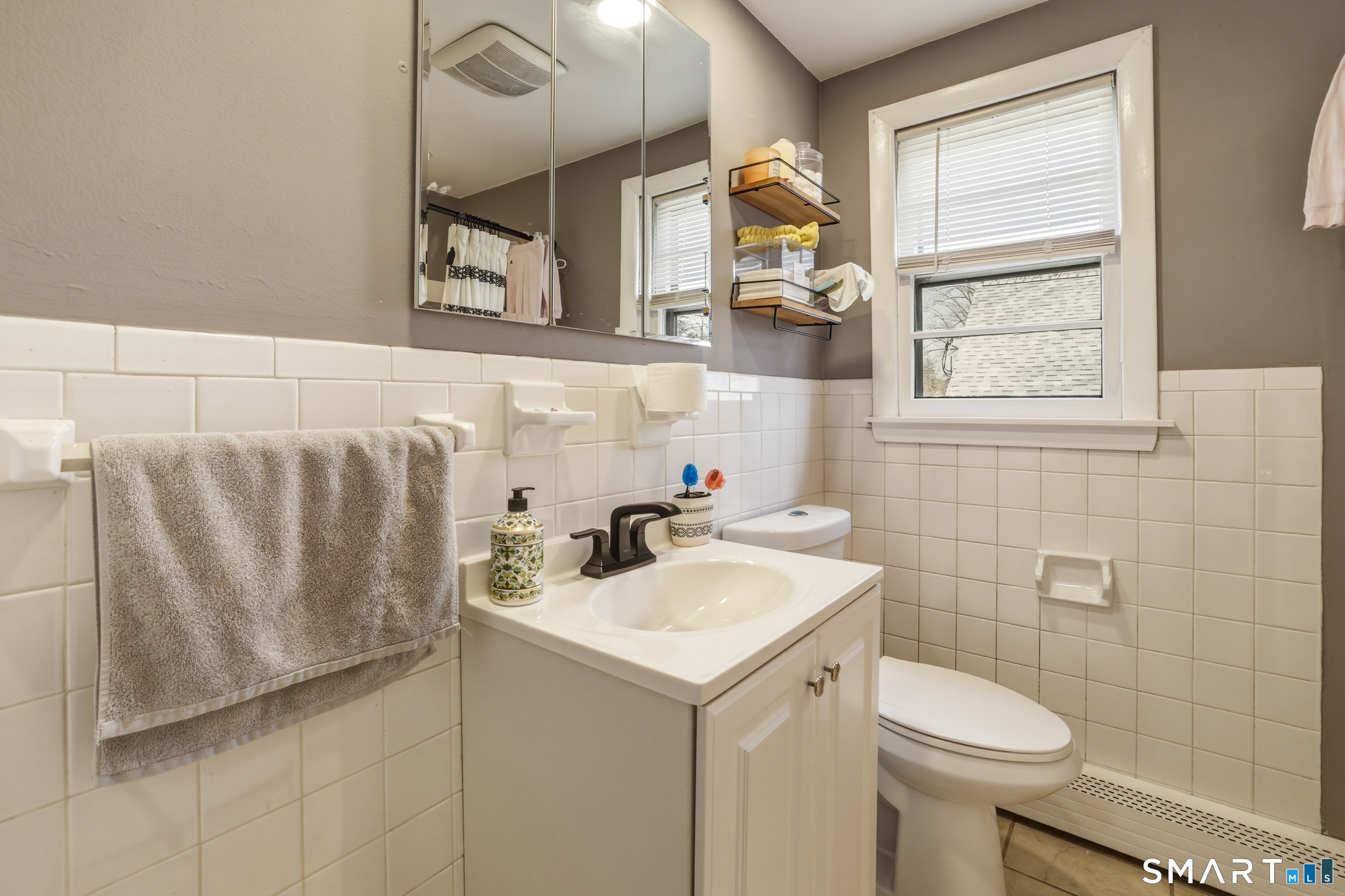 30 Lyndale Street Manchester, CT 06040 - Photo 13 of 37 a bathroom with a sink a toilet and a mirror
