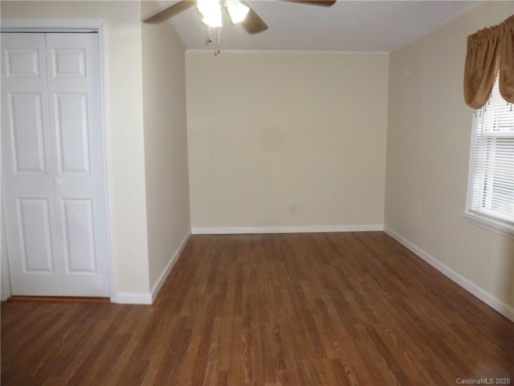 3643 Flat Creek Road Lancaster, SC 29720 - Photo 13 of 14 a view of an empty room with wooden floor and a window