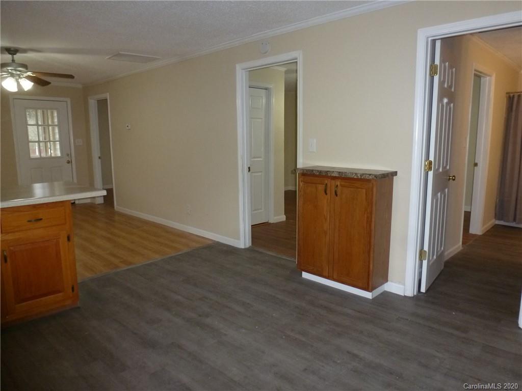 3643 Flat Creek Road Lancaster, SC 29720 - Photo 10 of 14 an empty room with wooden floor and windows