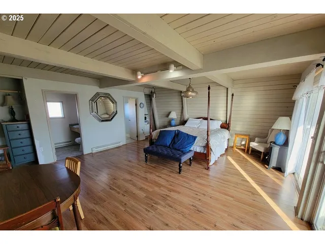 a bedroom with bed and window