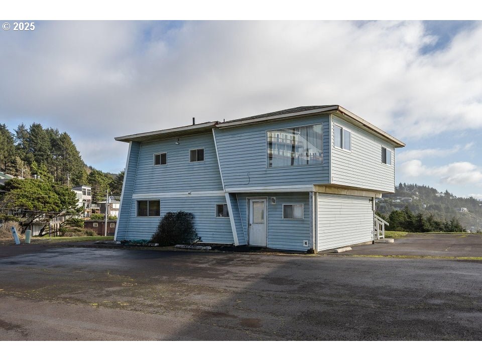 1816 Maxwell Mountain Road Oceanside, OR 97134 - Photo 9 of 18 a house view with a garden space