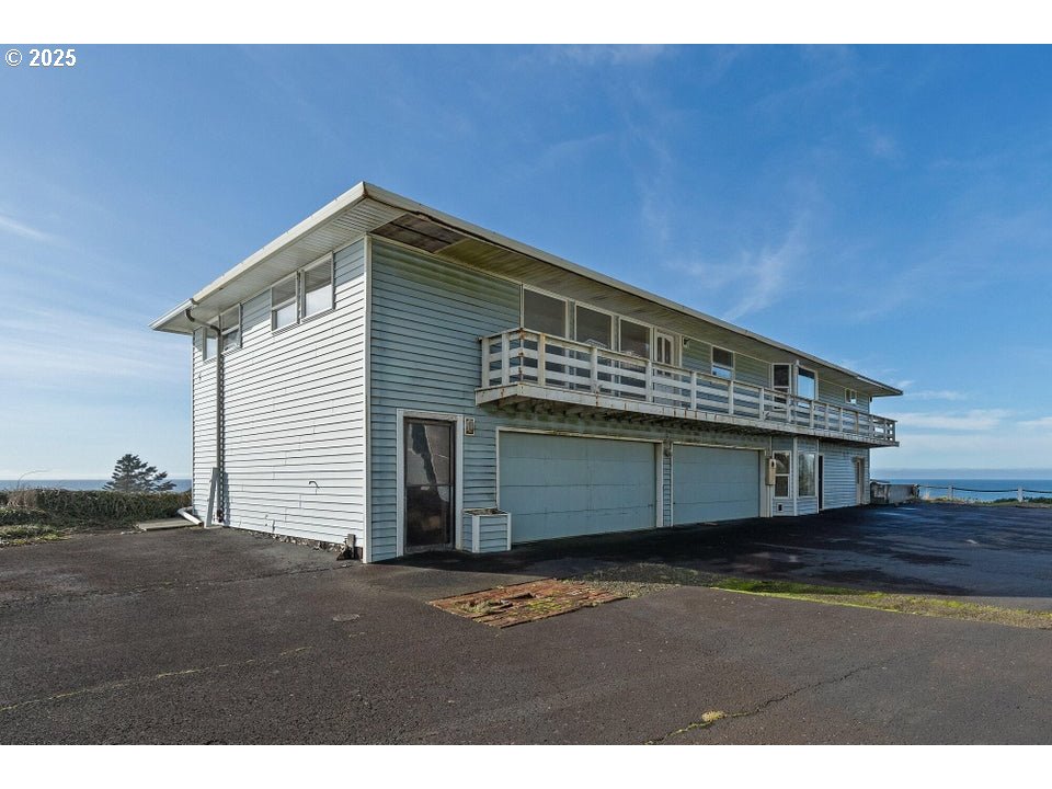 1816 Maxwell Mountain Road Oceanside, OR 97134 - Photo 10 of 18 a view of a house with a backyard