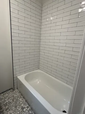 a bathroom with a bathtub