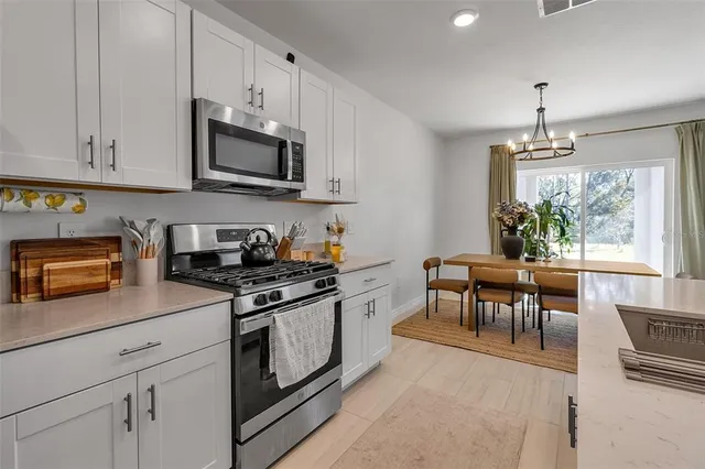 a bedroom with a bed and a chair